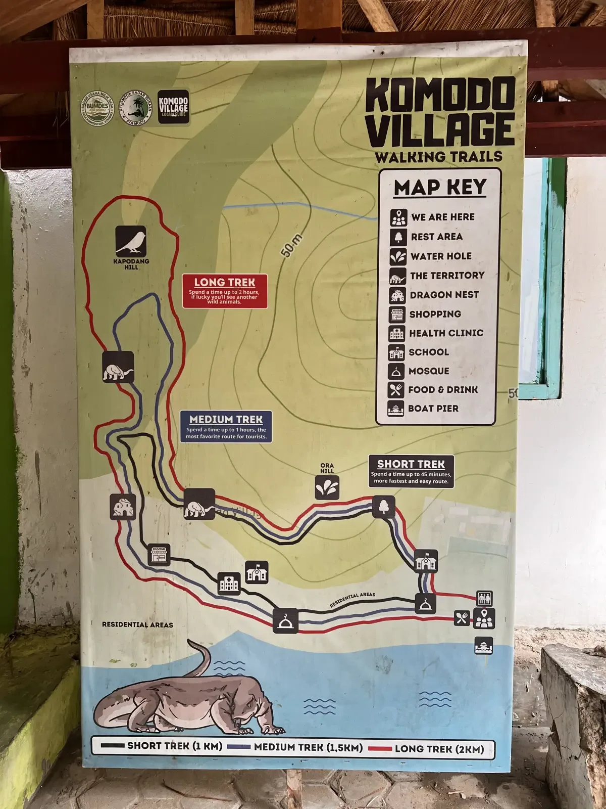 The Komodo Village Walking Trails map board in Komodo Village.